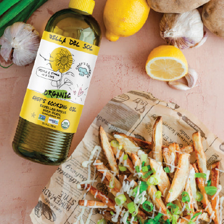 
                  
                    Bottle of Bella Del Sol Organic High Oleic Sunflower Cooking Oil next to loaded fries with green onions, garlic, lemon, and potatoes in a vibrant kitchen setting
                  
                