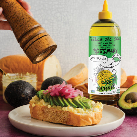 
                  
                    Bella Del Sol Rosemary-Infused Sunflower Oil with Avocado Toast and Fresh Ingredients on Counter
                  
                